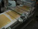 Конвеєр для довгих макаронів з системою різання.